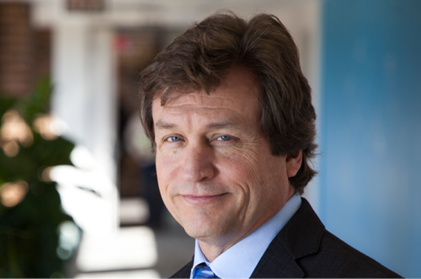 A white man with light brown hair wearing a business suit