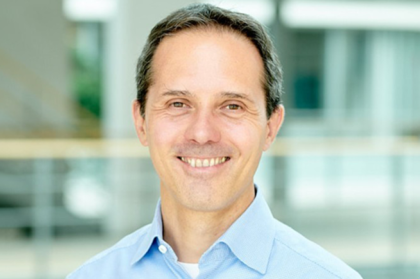a white man wearing a blue shirt