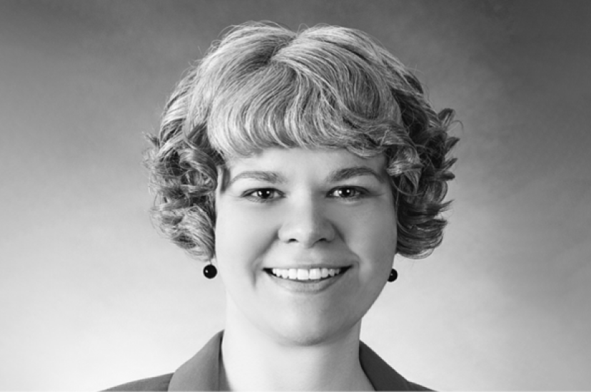 A black and white image of a white woman with short hair 