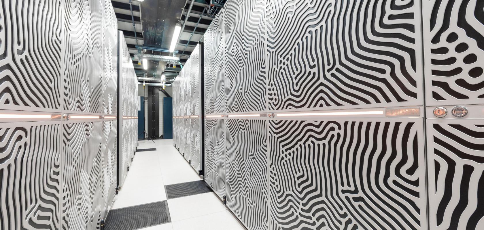 View between racks of the JUPITER supercomputer. Copyright: Forschungszentrum Jülich / Sascha Kreklau