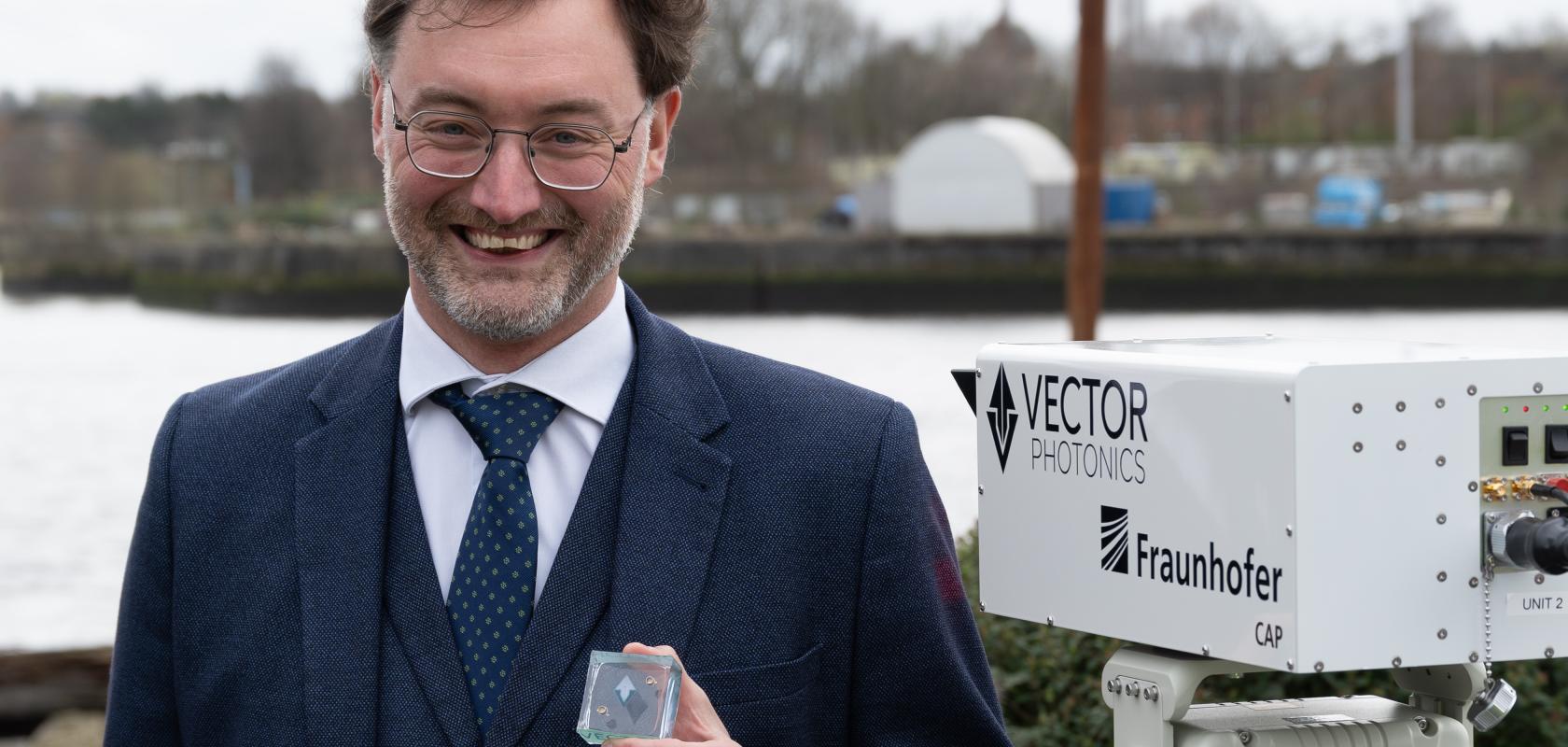 Dr Richard Taylor, CEO and Founder of Vector Photonics, with the PCSEL and optical communications system at the successful demo across the River Clyde.