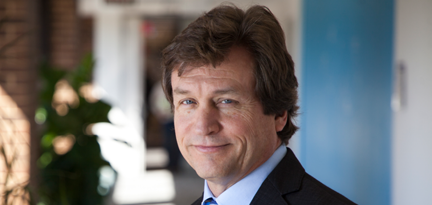 A white man with light brown hair wearing a business suit