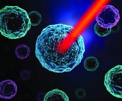 A graphic of a cell being destroyed by a laser